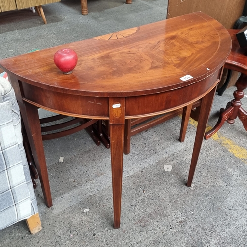 558 - Star lot An elegant flamed mahogany Regency style demi-lune table. Featuring starburst parquetry inl... 