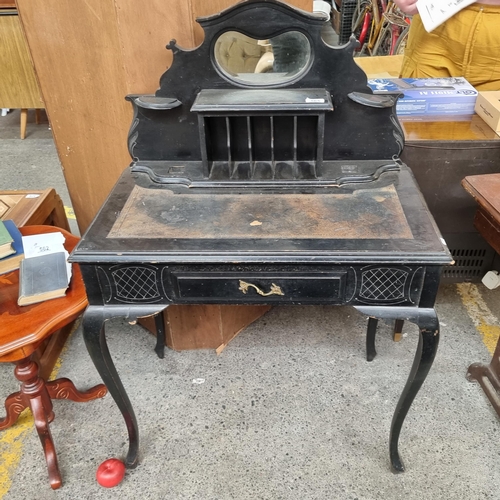 565 - An antique lacquered wood desk with embossed leather top, single drawer to front and high gallery ba... 