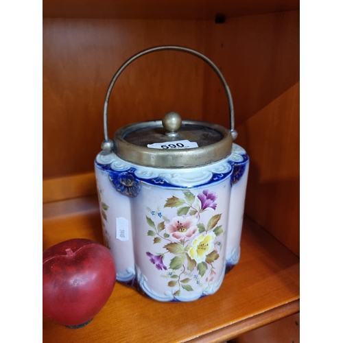 590 - A gorgeous Carlton Ware biscuit barrel, of lovely curved form and profusely adorned with colorful fl... 