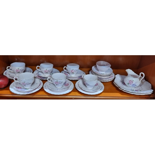 591 - A wonderful thirty-one piece tea service from Tuscan Fine Bone China. Including cups, saucers, side ... 