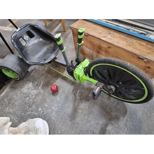 601 - A Huffy branded 'Green Machine' pedal cart. Designed with dual stick steering with rear wheel contro... 