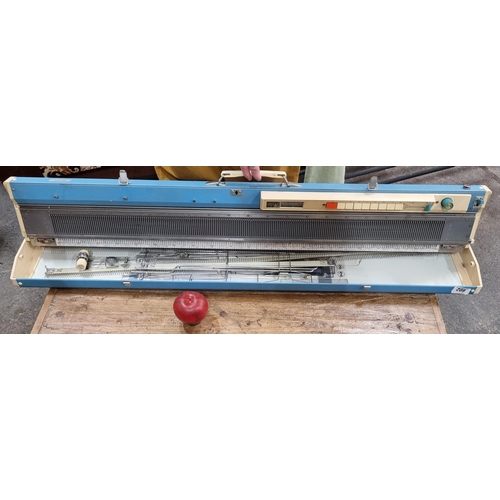 602 - A Jones KH-588 knitting machine, model number 4087175 dating to the 1960's in a lovely sky blue carr... 