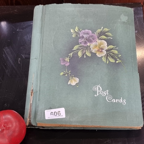 606 - A beautiful vintage postcard album holding a large variety of postcards depicting popular tourist de... 