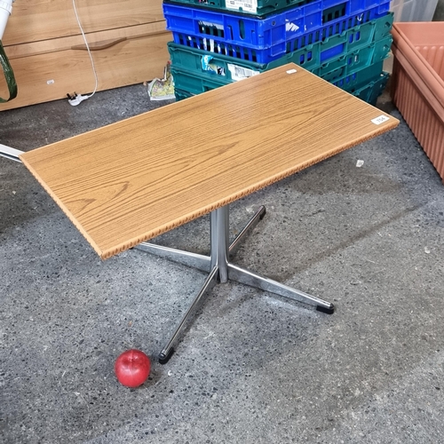 704 - A lovely neatly sized Mid century modern wine table with carved detailing to top held on a chrome qu... 