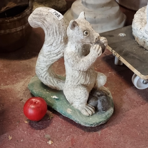 705 - A charming very heavy reconstituted stone garden sculpture of a hungry squirrel. MM: H35cm