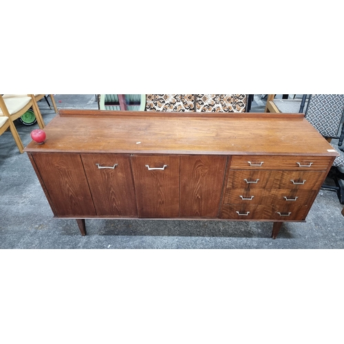 613 - Star Lot : A fabulous vintage mid-century modern sideboard with gallery back, four drawers to side a... 