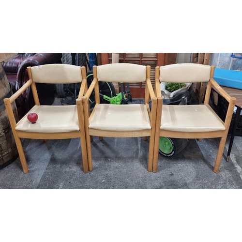 621 - A set of three chic mid-century Ercol  chairs with lovely turned pine frames cushion to seat and bac... 