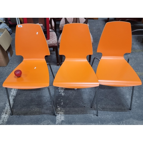 622 - A set of three dining chairs by IKEA in the Vilmar range in a bright and snazzy orange colour.