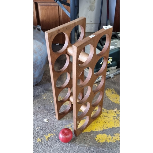 724 - A cool and contemporary wooden wine bottle holder, with capacity to hold ten wine bottles.