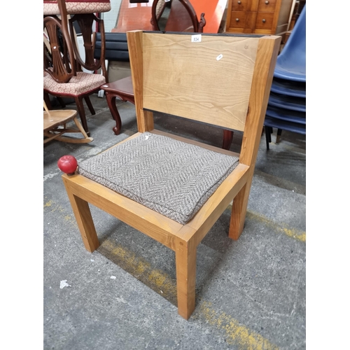 634 - Star Lot - A large and exceptionably heavy mid century oversized occasional chair. Crafted with a ge... 