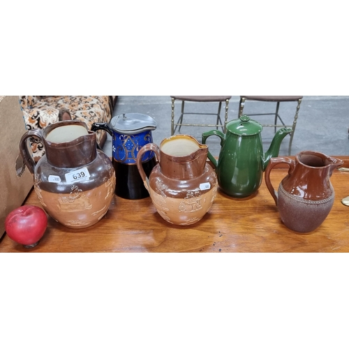 639 - A selection of five vintage and antique ceramic vessels including a pair of graduating stoneware exa... 