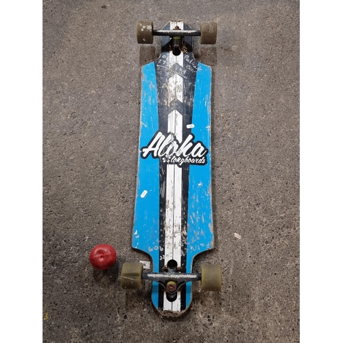 737 - An Aloha longboard skateboard with four rubber wheels.