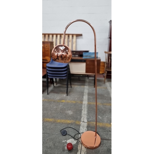 643 - A stylish contemporary floor lamp in a copper tone in the George series. A nice neat sized example i... 