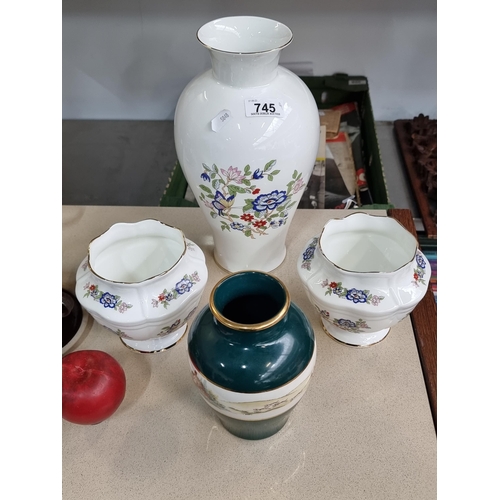 745 - Four ceramic vases including three from Royal Tara featuring a floral pattern and another from Art C... 