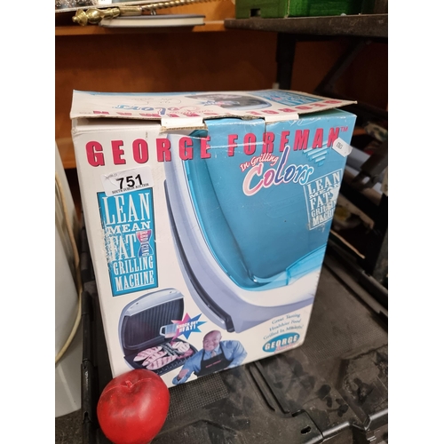 751 - A brand new George Forman 'The Lean Mean Fat Grilling Machine' grill model GR20BW. With original ins... 