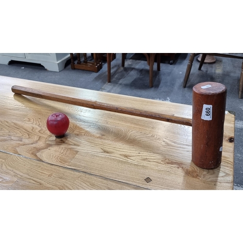 660 - An early 20th century vintage croquet mallet. A great item with lots of character crafted from wood ... 