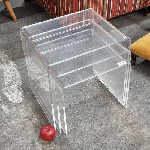 777 - A set of three Lucite nesting tables.