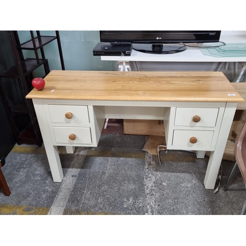 677 - A charming desk in a distressed green finish with a beechwood top and turned beech pull handles. A n... 