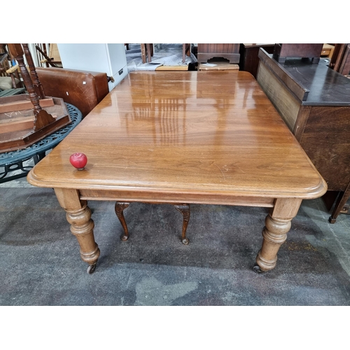 786 - Star Lot : A Super golden Oak Victorian Dining table, With round thick legs and a curved border a ve... 