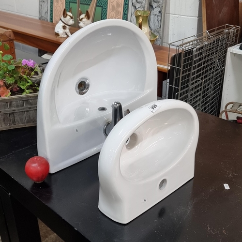 684 - Two ceramic sink basins including a larger example with a chrome tap and fittings to base. Along wit... 