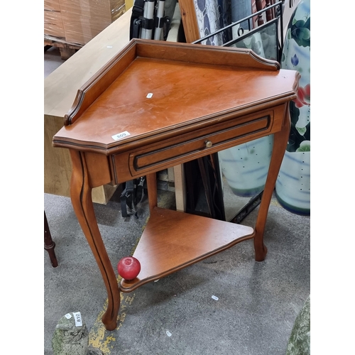 809 - A delightful corner table with gallery back, single drawer to front and a lower tier for further sto... 