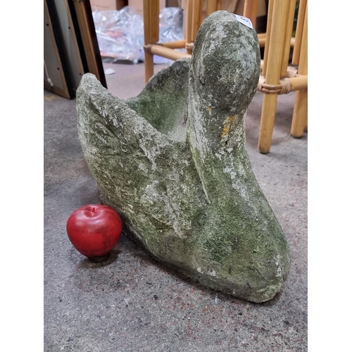 811 - A good sized antique stone garden planter in the for of an elegant swan.