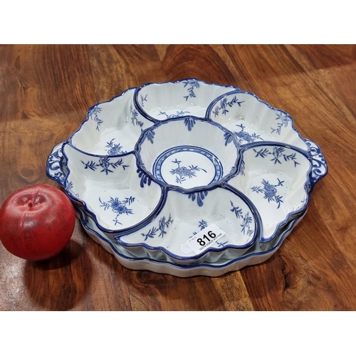 816 - A delightful chinese sweet meats platter with 7 porcelain dishes in a hand painted blue and white fl... 