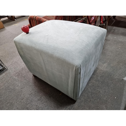 828 - A very large cube footstool upholstered in a soft grey fabric held on bun feet. Mm: L65 x W80 x H56c... 