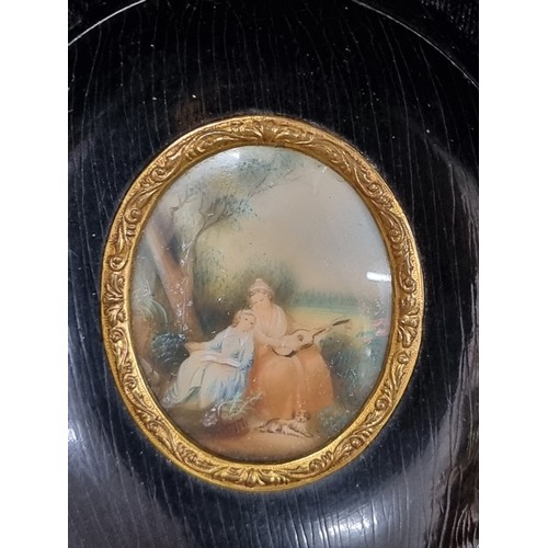 238 - A delightful miniature oil on porcelain painting featuring an outdoor scene of two figures relaxing ... 