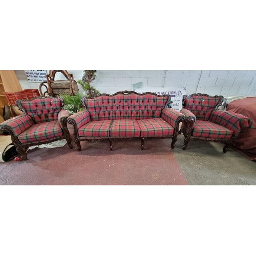 693 - Star Lot : A three piece suite consisting of two arm chairs and a three seater sofa each with button... 