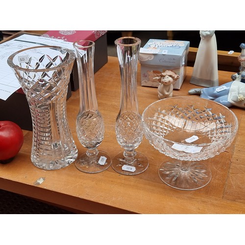 780 - Four Waterford crystal items including a trumpet vase, two bud vases in the Lismore pattern, and a l... 