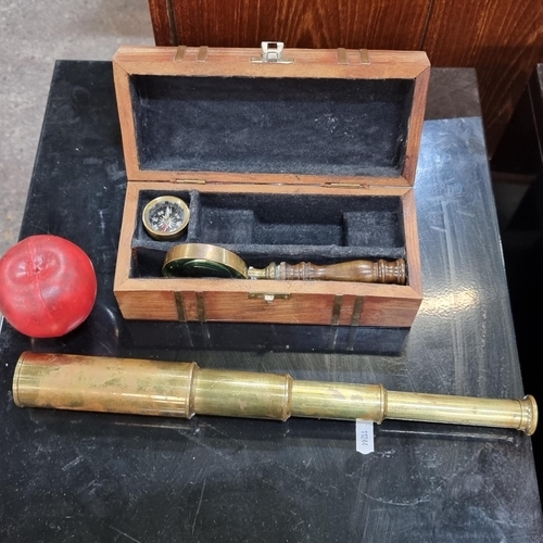 608 - A nautical Captain's set, including magnifying glass with turned wood handle, brass  three draw tele... 