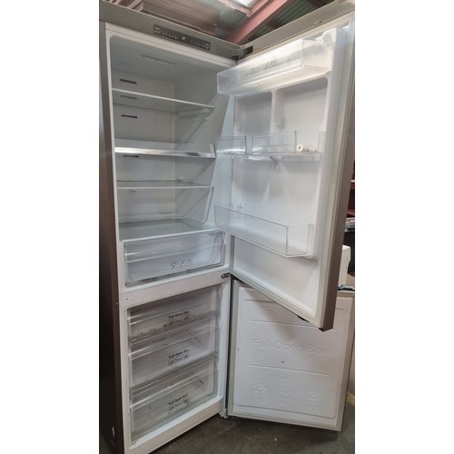 698 - Star Lot : A Samsung branded refrigerator / freezer. Model RB29FSRNDSA. A stylish silver grey unit w... 