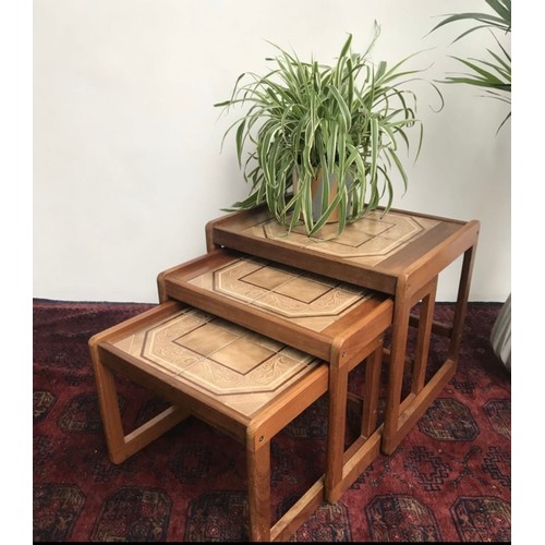 576 - Star Lot : A super attractive trio of mid century nesting tables; with very cool open teak frames an... 