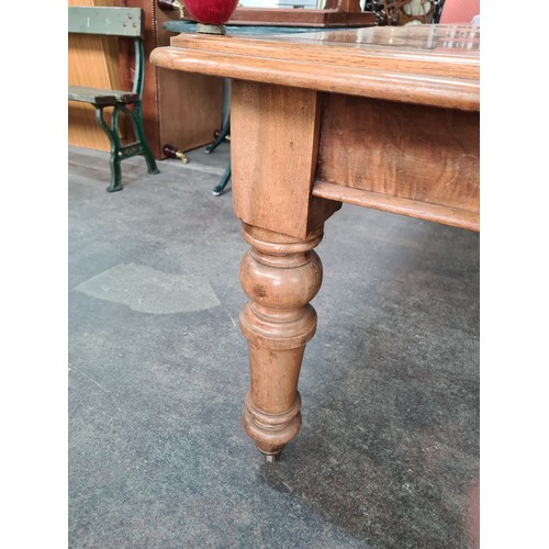 786 - Star Lot : A Super golden Oak Victorian Dining table, With round thick legs and a curved border a ve... 