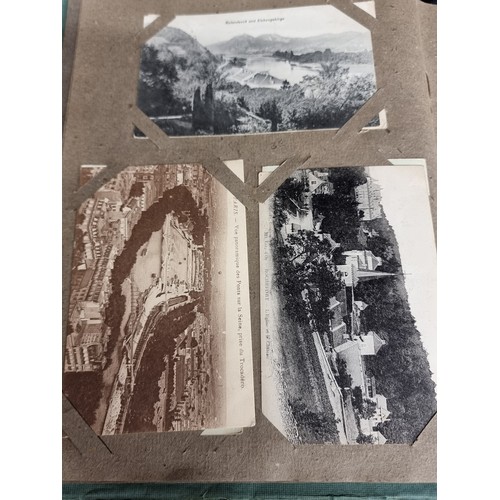 606 - A beautiful vintage postcard album holding a large variety of postcards depicting popular tourist de... 