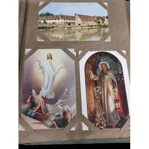 606 - A beautiful vintage postcard album holding a large variety of postcards depicting popular tourist de... 