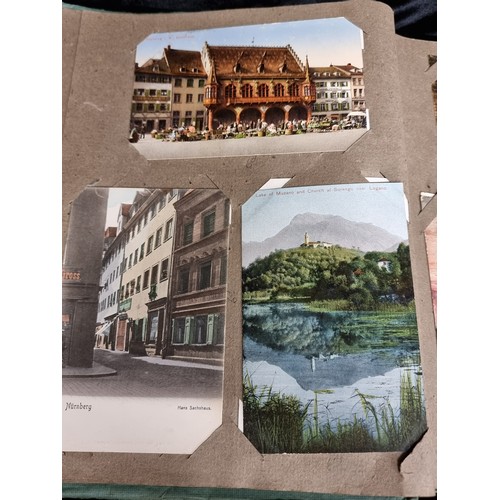 606 - A beautiful vintage postcard album holding a large variety of postcards depicting popular tourist de... 