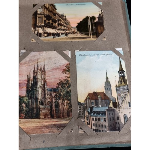 606 - A beautiful vintage postcard album holding a large variety of postcards depicting popular tourist de... 