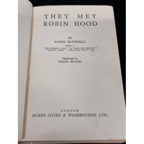 288 - A vintage hardback book titled 'They Met Robin Hood' featuring a hollowed centre for the discrete hi... 