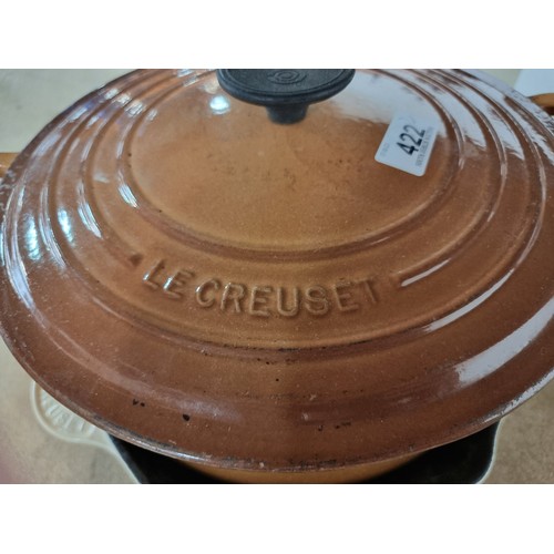 422 - Two very heavy enamel cast iron Le Creuset items including a lidded casserole pot and a griddle pan.