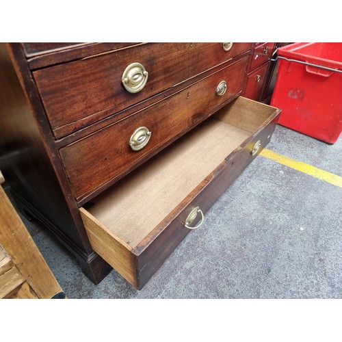 470 - Star lot : A handsome Georgian chest of six graduating drawers in a Campaign aesthetic. Featuring br... 