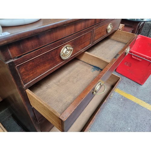 470 - Star lot : A handsome Georgian chest of six graduating drawers in a Campaign aesthetic. Featuring br... 