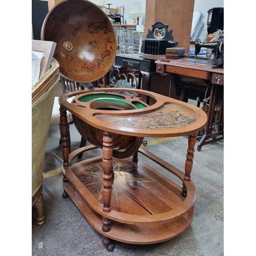 479 - Star Lot - A fantastic vintage world globe drinks cabinet. Designed in an antique style with a large... 