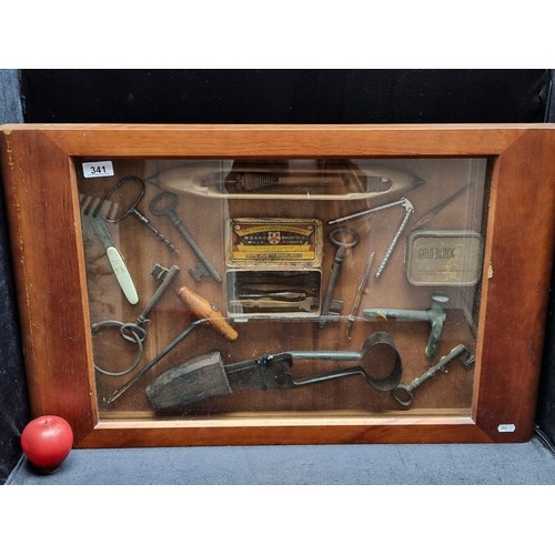 341 - Star Lot - A vintage shadow box containing a mix of antique tools, keys, and a loom. H50cm x W78cm