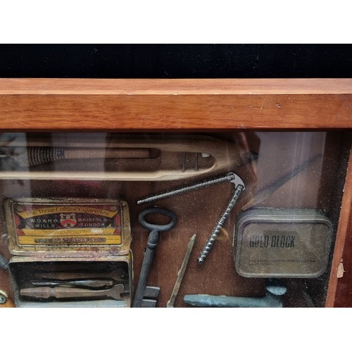 341 - Star Lot - A vintage shadow box containing a mix of antique tools, keys, and a loom. H50cm x W78cm