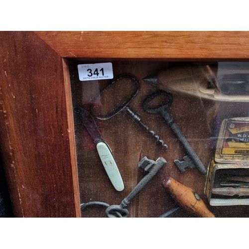 341 - Star Lot - A vintage shadow box containing a mix of antique tools, keys, and a loom. H50cm x W78cm