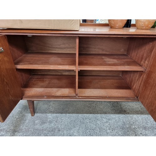 613 - Star Lot : A fabulous vintage mid-century modern sideboard with gallery back, four drawers to side a... 