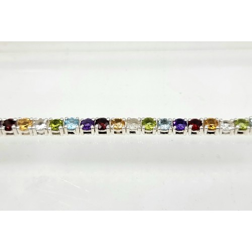 8 - A fine example of a multi natural gemstone tennis bracelet, set with beautiful Amethyst, Blue Topaz,... 