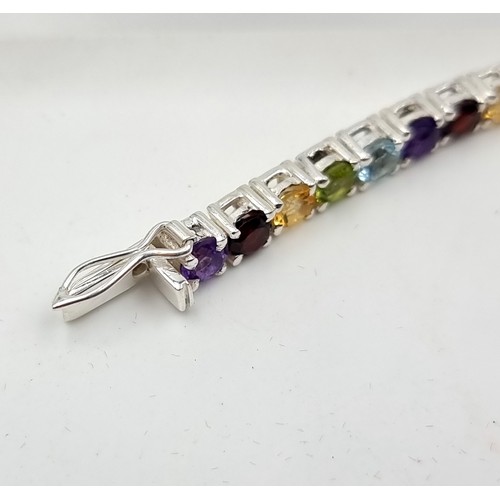 8 - A fine example of a multi natural gemstone tennis bracelet, set with beautiful Amethyst, Blue Topaz,... 